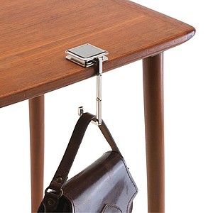 Fold-out handbag holder with a stainless steel surface for advertisement,colour silver