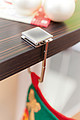 Fold-out handbag holder with a stainless steel surface for advertisement,colour silver