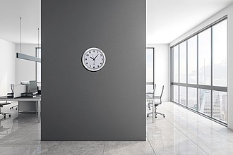 Round media clock made of metal, white